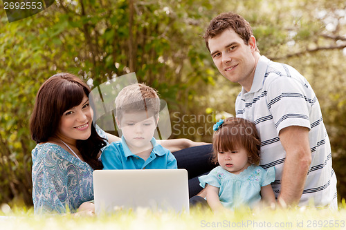 Image of Outdoor Family with Computer