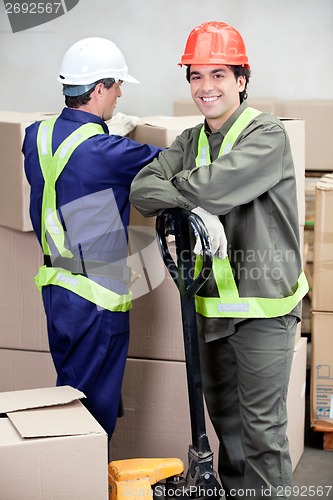 Image of Foreman With Colleague Working At Warehouse