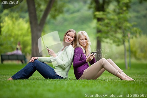 Image of Women With Cellphones In Park