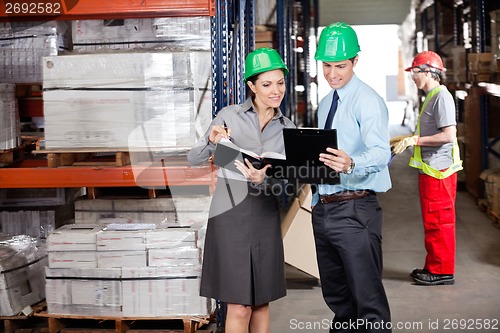Image of Supervisors And Foreman Working At Warehouse