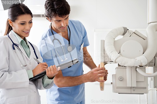 Image of Radiologist And Technician Working Together