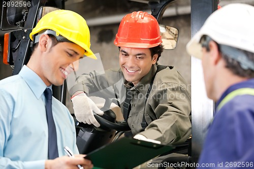 Image of Workers And Supervisors At Warehouse