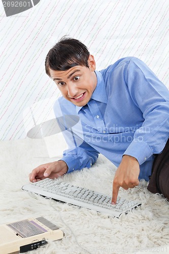 Image of Geek Businessman Pressing Buttons Of Keyboard