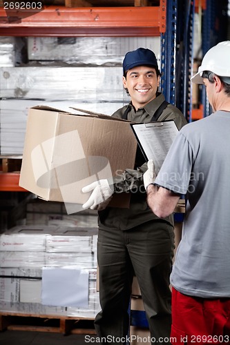 Image of Foreman Looking At Supervisor With Clipboard