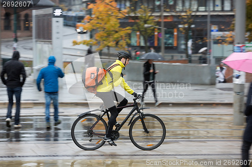 Image of Male Cyclist With Backpack On Street