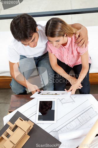 Image of Couple Looking At House Plans