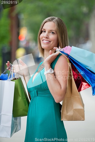 Image of Woman Carrying Shopping Bags