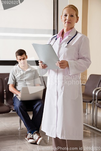 Image of Female Doctor Holding File