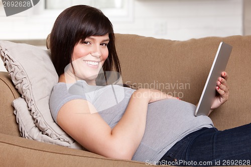Image of Pregnant Woman Using Digital Tablet