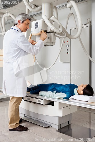 Image of Radiologist Ready To Take X-ray Of Patient