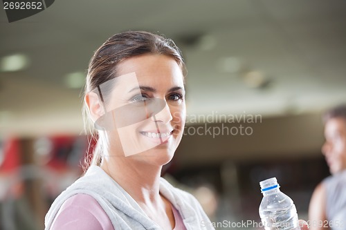 Image of Woman Holding Bottle Of Water At Health Club