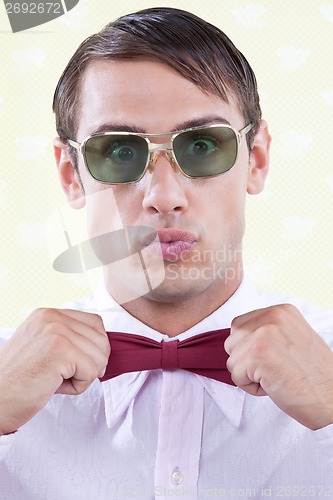 Image of Man Adjusting Bow Tie