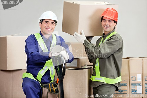 Image of Foremen Loading Cardboard Boxes At Warehouse