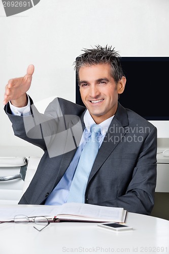 Image of Businessman Offering Handshake In Office
