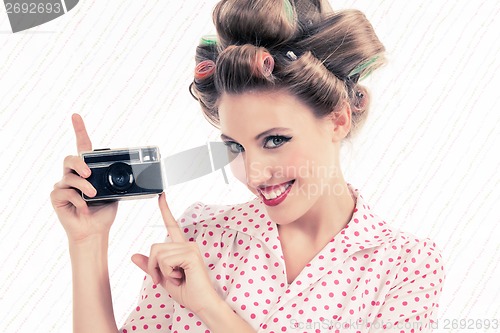 Image of Woman holding Old Camera