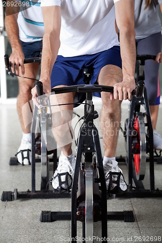 Image of Low Section Of People On Exercise Bikes