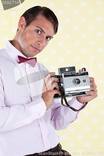 Image of Male Holding Medium Format Camera