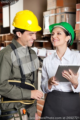 Image of Supervisor With Digital Tablet And Foreman At Warehouse