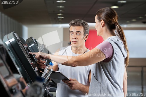 Image of Woman Asking About Machines In Gym