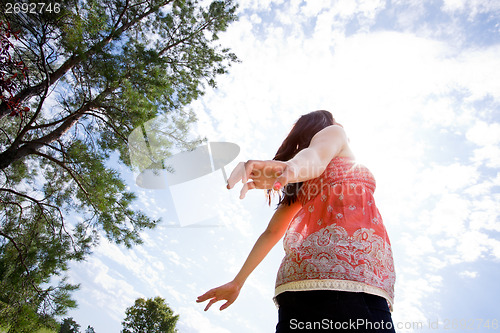 Image of Pregnant Woman Looking to Sky