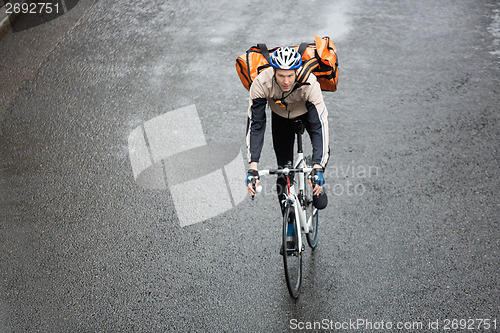 Image of Male Cyclist With Backpack On Street