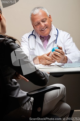 Image of Doctor Holding Medicine Box