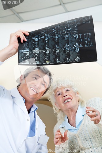 Image of Doctor And Patient Looking At X-ray