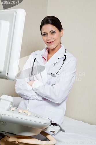 Image of Female Radiologist Sitting Hands Folded