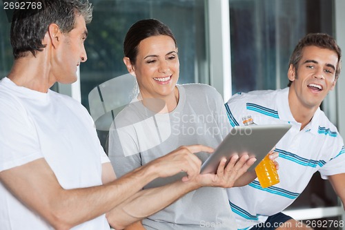 Image of Friends Using Digital Tablet