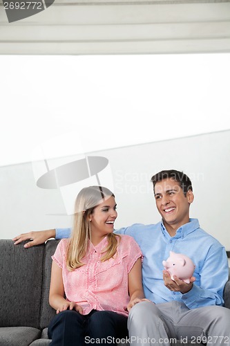 Image of Couple With Piggybank