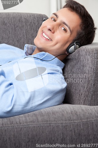 Image of Relaxed Young Man on Couch