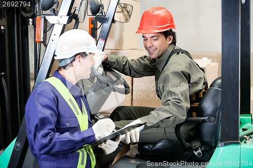 Image of Forklift Driver Communicating With Supervisor