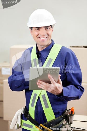 Image of Foreman Using Digital Tablet At Warehouse
