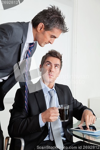 Image of Businessman With Digital Tablet In A Meeting With Colleague