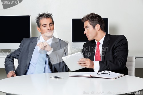 Image of Businessmen Using Digital Tablet At Desk