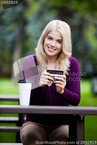 Image of Portrait of Young Woman with Cell Phone