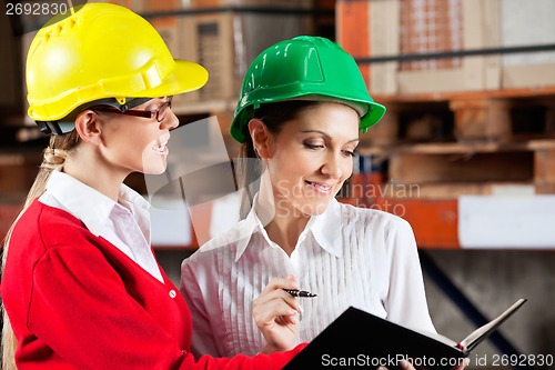 Image of Female Supervisor And Colleague Working Together