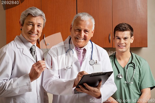 Image of Happy Doctor With Colleagues