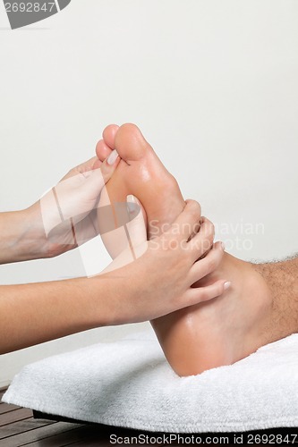 Image of Woman Massaging Foot