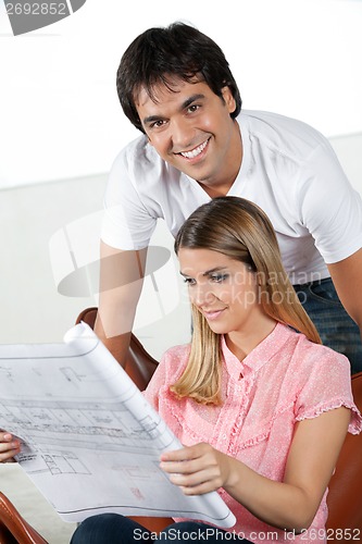 Image of Woman Looking At Blueprint