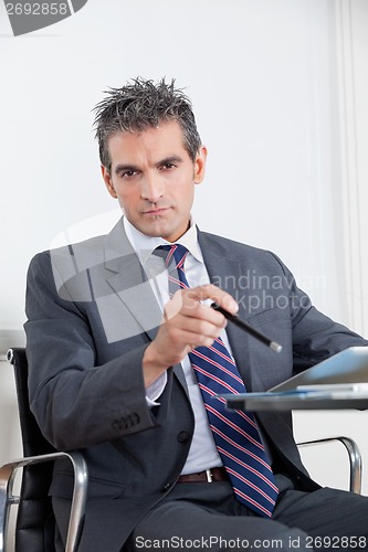 Image of Businessman With Digital Tablet In Office