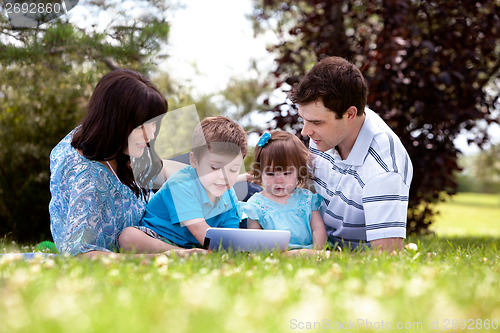 Image of Outdoor Family with Digital Tablet