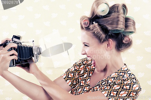 Image of Woman holding a Vintage Camera