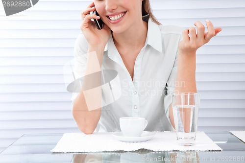Image of Young Woman Having Breakfast