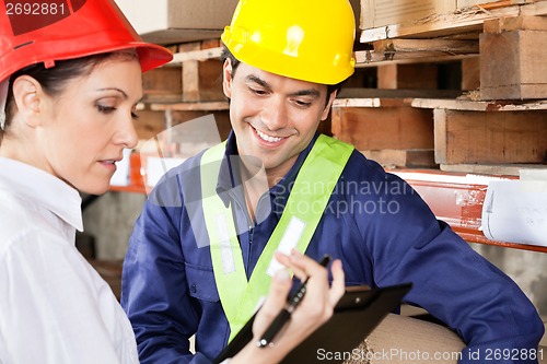 Image of Supervisor Showing Clipboard To Foreman