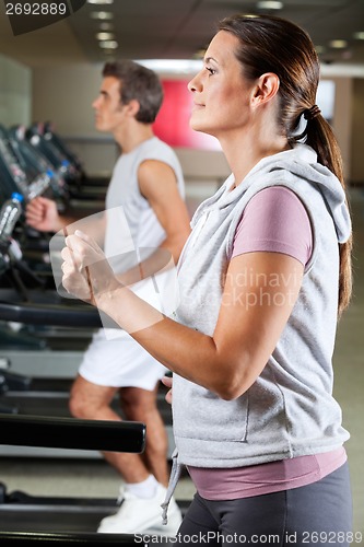 Image of People Running On Treadmill