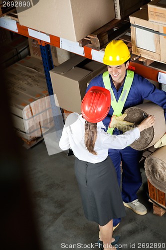 Image of Female Supervisor Communicating With Foreman