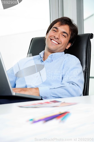Image of Interior Designer Using Laptop