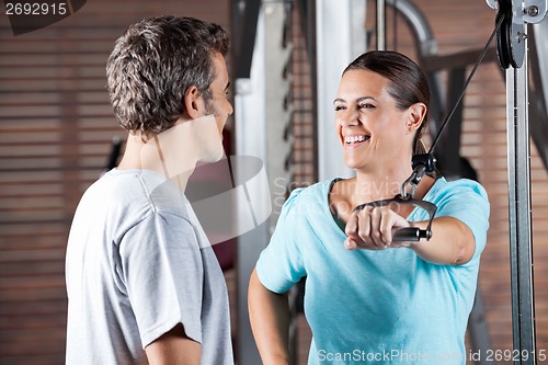 Image of Woman Working Out While Looking At Instructor