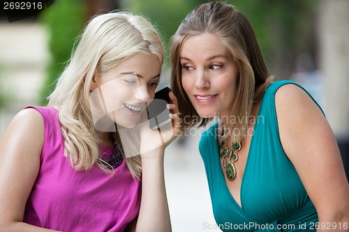 Image of Young Woman Using Cell Phone